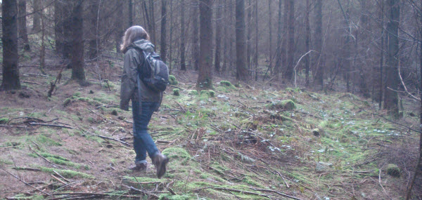 Val walking in the woods